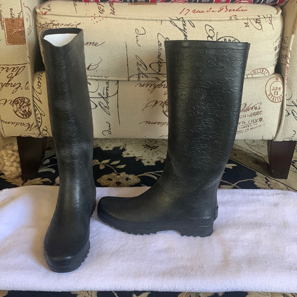 Ugg black rain boots never worn.